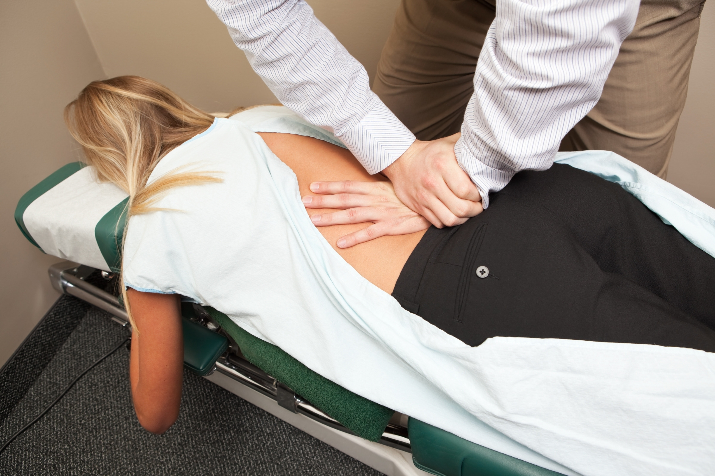 Static and motion palpation of the spine by hand